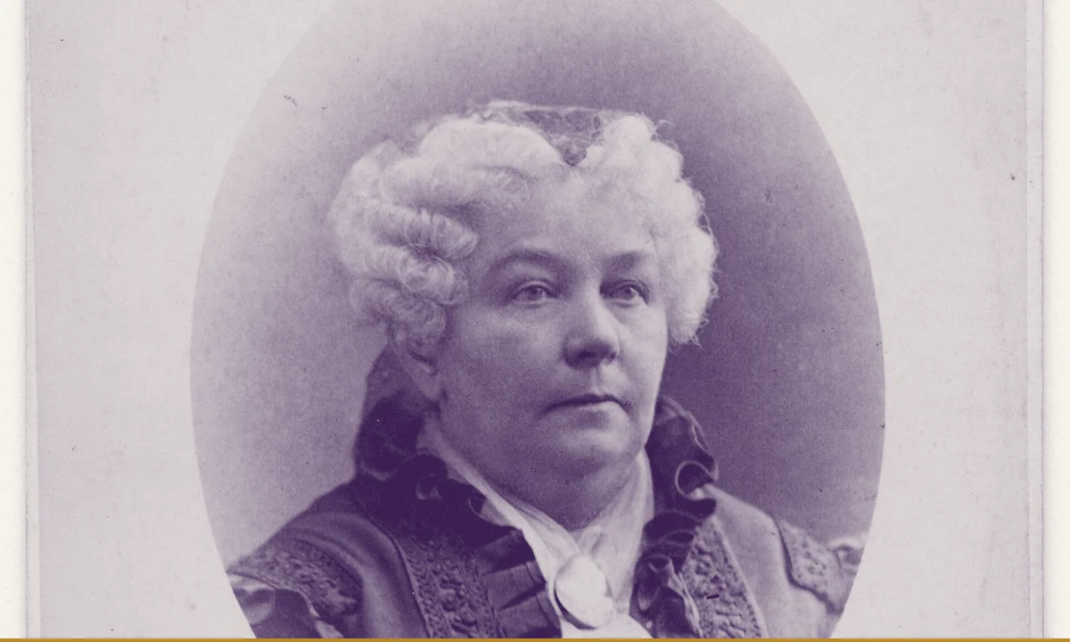 A portrait of Elizabeth Cady Stanton seated at a desk.